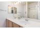 Bright bathroom with a double sink vanity and large mirror at 9142 W Pontiac Dr, Peoria, AZ 85382