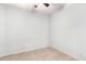 Bright bedroom with neutral walls, tile flooring, and ceiling fan at 9142 W Pontiac Dr, Peoria, AZ 85382