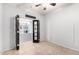 Bonus room featuring double doors, tile flooring and views through to the kitchen at 9142 W Pontiac Dr, Peoria, AZ 85382
