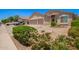A charming home with a well-manicured desert landscaped front yard in a quiet neighborhood at 9142 W Pontiac Dr, Peoria, AZ 85382