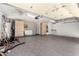 Spacious garage with epoxy flooring, built-in cabinets, and ample storage at 9142 W Pontiac Dr, Peoria, AZ 85382