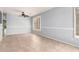 A room featuring a ceiling fan, tiled floors, and natural light from window with shutters at 9142 W Pontiac Dr, Peoria, AZ 85382