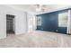 Main bedroom featuring carpeted floors, windows with blinds, and a walk-in closet at 9142 W Pontiac Dr, Peoria, AZ 85382