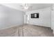 This is the main bedroom with soft carpet, a ceiling fan, and plenty of space at 9142 W Pontiac Dr, Peoria, AZ 85382