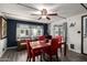 Dining room with modern ceiling fan and bright red dining set at 9302 E Broadway Rd # 122, Mesa, AZ 85208