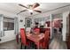 The Dining room features a bright red table with a view into the kitchen at 9302 E Broadway Rd # 122, Mesa, AZ 85208