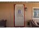 Inviting covered patio with charming door and a warm welcome for Gathering and friends at 9302 E Broadway Rd # 122, Mesa, AZ 85208
