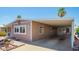 Charming home featuring covered parking and a well-maintained desert-style landscaped front yard at 9302 E Broadway Rd # 122, Mesa, AZ 85208