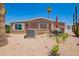 Cozy single-story home featuring a patio with dining set and desert landscaping at 9302 E Broadway Rd # 122, Mesa, AZ 85208