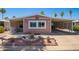 Charming home featuring covered parking and a well-maintained desert-style landscaped front yard at 9302 E Broadway Rd # 122, Mesa, AZ 85208