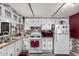 The kitchen is compact with white cabinets and vintage-style appliances at 9302 E Broadway Rd # 122, Mesa, AZ 85208