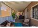 Relaxing covered patio area featuring comfortable seating and protection from the elements at 9302 E Broadway Rd # 122, Mesa, AZ 85208