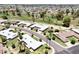 Beautiful aerial view of homes in a golf course community with mature landscaping and well-maintained lawns at 9915 W Mountain View Rd, Sun City, AZ 85351