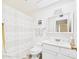 Clean bathroom featuring a shower/tub combo, white vanity, and ample cabinet space at 9915 W Mountain View Rd, Sun City, AZ 85351