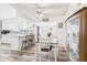 Bright dining area with wood-look floors, an open layout, and views into the updated kitchen at 9915 W Mountain View Rd, Sun City, AZ 85351