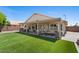 Spacious backyard featuring lush artificial grass and a covered patio with comfortable seating at 1030 S Brentwood Ct, Chandler, AZ 85286