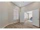 Bright, spacious room with vaulted ceilings, wood floors and a shuttered arched window at 1030 S Brentwood Ct, Chandler, AZ 85286
