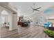 Bright, open-concept living area featuring wood floors, neutral paint, and seamless flow to the kitchen at 1030 S Brentwood Ct, Chandler, AZ 85286