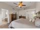 Main bedroom with vaulted ceiling, wooden floors, and ensuite bathroom at 1030 S Brentwood Ct, Chandler, AZ 85286