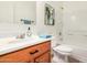Bright bathroom features a white tile shower over tub, and a vanity with a wood finish at 1086 E Canyon Trail --, San Tan Valley, AZ 85143