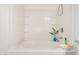 Clean bathtub with white tile surround and built-in shelves at 1086 E Canyon Trail --, San Tan Valley, AZ 85143
