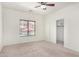 Bright bedroom featuring a ceiling fan, pool views from the window, and a closet with sliding doors at 1086 E Canyon Trail --, San Tan Valley, AZ 85143