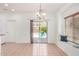 Bright dining area with tile flooring featuring a sliding door to the backyard, complemented by a window seat at 1086 E Canyon Trail --, San Tan Valley, AZ 85143