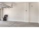 Spacious garage with an open door, light walls, and lots of room for parking cars at 1086 E Canyon Trail --, San Tan Valley, AZ 85143