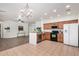 Well-designed kitchen with oak cabinets, tile flooring, black appliances, and seamless transition to living space at 1086 E Canyon Trail --, San Tan Valley, AZ 85143