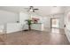 Spacious living area offers views of the pool, blending indoor comfort with outdoor leisure, and wood flooring at 1086 E Canyon Trail --, San Tan Valley, AZ 85143