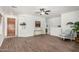 Bright living room boasts neutral walls, stylish wood flooring, and an open layout, perfect for gatherings at 1086 E Canyon Trail --, San Tan Valley, AZ 85143