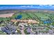 Scenic aerial shot showcases a well-manicured golf course community with tree-lined streets and resort-style amenities at 119 E Camellia Way, San Tan Valley, AZ 85140