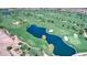Aerial view of the sprawling green golf course with several lakes and sand traps at 119 E Camellia Way, San Tan Valley, AZ 85140