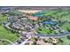Birds-eye view features tennis courts, a clubhouse and lush landscaping in an active golf course community at 119 E Camellia Way, San Tan Valley, AZ 85140