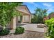 This backyard boasts a covered patio with an outdoor fire pit for relaxing outdoors at 119 E Camellia Way, San Tan Valley, AZ 85140