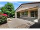 The backyard is landscaped, and includes an outdoor fire pit and covered patio at 119 E Camellia Way, San Tan Valley, AZ 85140