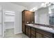 This bathroom has dual sinks, storage, and a door to the toilet and shower room at 119 E Camellia Way, San Tan Valley, AZ 85140