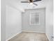 A bright, empty bedroom with neutral paint and tile flooring at 119 E Camellia Way, San Tan Valley, AZ 85140