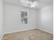Neutral bedroom featuring tile flooring, a ceiling fan and a window with great light at 119 E Camellia Way, San Tan Valley, AZ 85140