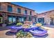 A charming courtyard with a blue tiled fountain enhances the curb appeal of this beautiful house at 119 E Camellia Way, San Tan Valley, AZ 85140