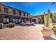 An enchanting courtyard with a blue tile fountain adds elegance to the home's exterior at 119 E Camellia Way, San Tan Valley, AZ 85140