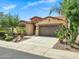 Charming single-Gathering home featuring a well-manicured lawn with desert landscaping and a two-car garage at 119 E Camellia Way, San Tan Valley, AZ 85140