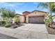 Beautiful home with a well-manicured yard and a two-car garage at 119 E Camellia Way, San Tan Valley, AZ 85140