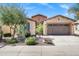 Charming home featuring desert landscaping, a two-car garage, and a brick-accented facade at 119 E Camellia Way, San Tan Valley, AZ 85140