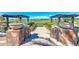 A scenic view from stone stairs overlooking the lush golf course, complete with manicured landscaping at 119 E Camellia Way, San Tan Valley, AZ 85140