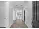 Bright hallway with tile flooring leading to various rooms in the home at 119 E Camellia Way, San Tan Valley, AZ 85140