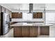 This kitchen has a large island, stainless steel appliances, and pendant lighting at 119 E Camellia Way, San Tan Valley, AZ 85140