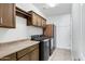 Functional laundry room with cabinets, countertop space, and modern appliances at 119 E Camellia Way, San Tan Valley, AZ 85140