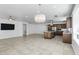 Open-concept kitchen and living room with abundant natural light and modern fixtures for comfortable living at 119 E Camellia Way, San Tan Valley, AZ 85140