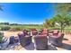 An elegant outdoor seating area overlooks the serene golf course, perfect for relaxation and conversation at 119 E Camellia Way, San Tan Valley, AZ 85140